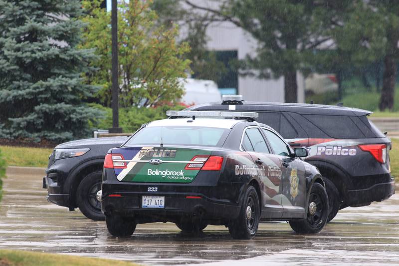 Squad cars at the WeatherTech complex in Bolingbrook on Saturday June 25, 2022 after reports of a shooting.