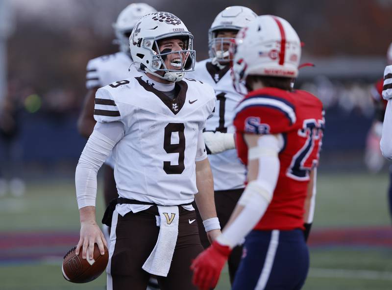Mt. Carmel's Jack Eliott (9) reacts to a positive yardage play during the class 7A semi-final playoff game between Mt. Carmel and St. Rita high schools on Saturday, Nov. 23, 2024 in Chicago.