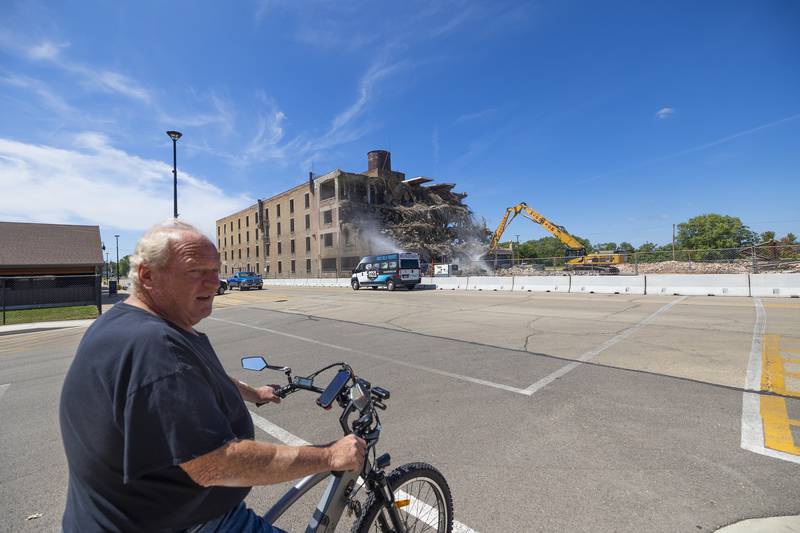 Kevin Williamson of Rock Falls stops to watch the demolition of the Micro Industries building Wednesday, Aug. 21, 2024, in Rock Falls. Crews from McDonagh got to work on the project in early August.