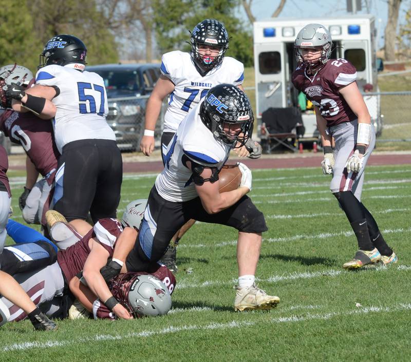 Eastland-Pearl City's Jaxsyn Kempel (21) almost breaks away from Rockridge defenders during a first round game in the 2A state football playoffs on Saturday, Nov. 2, 2024 at Eddington.