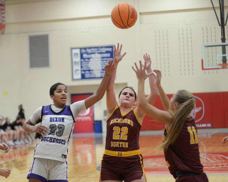 Dixon's Ahmyrie McGowan (23), Richmond Burton's Matilda Furzland (220 and Meadow Rosendahl (11) battle for a rebound at the Oregon Girls Basketball Tip-Off Tournament on Wednesday, Nov. 20, 2024 at the Blackhawk Center in Oregon.