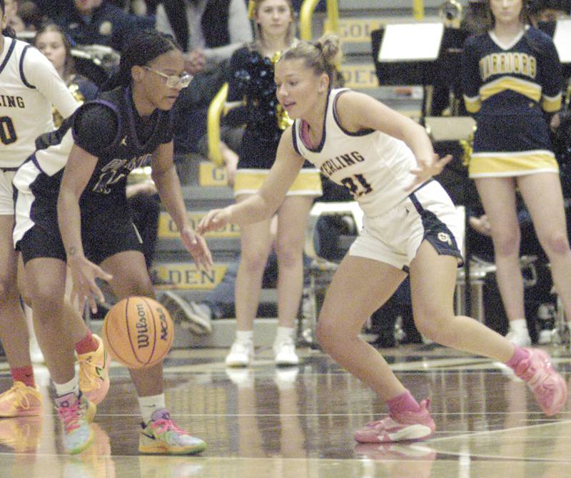 Sterling's Jae James tries to get the ball from Plano's Jadyn Long. The Sterling Golden Warriors faced off against Plano Lady Reapers in an IHSA 3A Regional girls final at Musgrove Fieldhouse in Sterling on February 20, 2025. Sterling won the game 70-38.