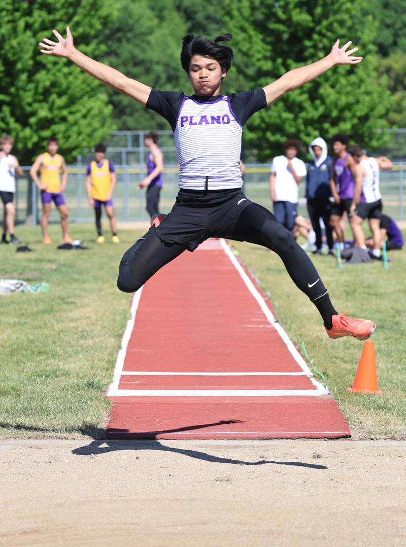 Plano’s Jayden Balingit takes his attempt at the long jump Wednesday, May 20, 2026, during the Class 2A boys track sectional at Rochelle High School.