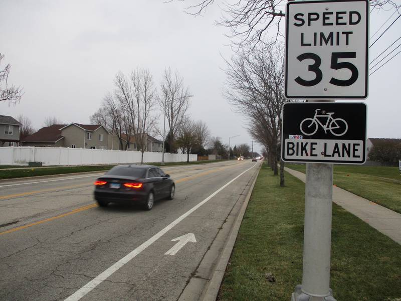 Sign on Drauden Road marks the start of a one-mile section of street containing Joliet's only bike lanes. Nov. 17, 2022.