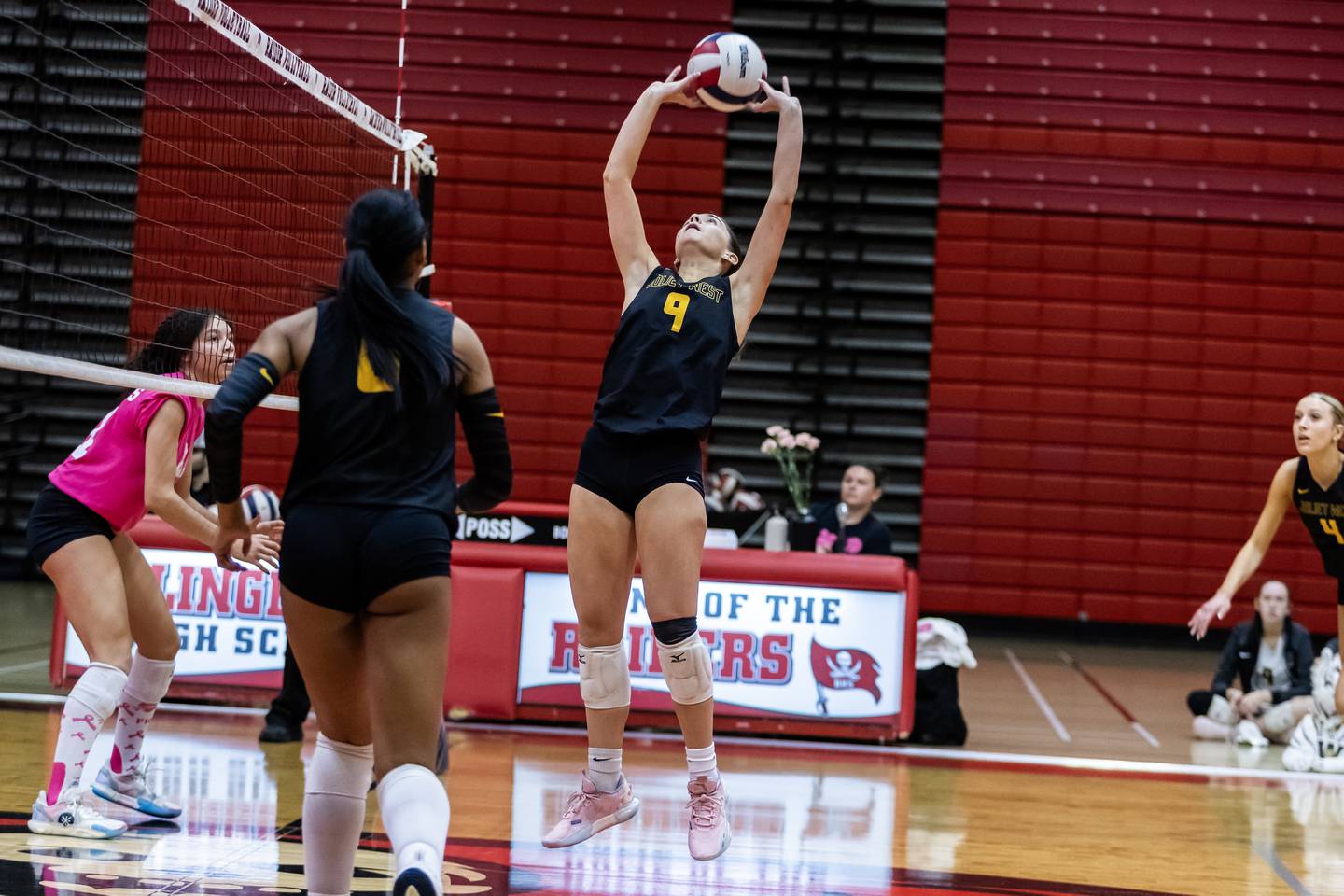 Joliet West's Julia Adams sets up a teammate during a varsity volleyball game against Bolingbrook at Bolingbrook on Oct. 16, 2025.