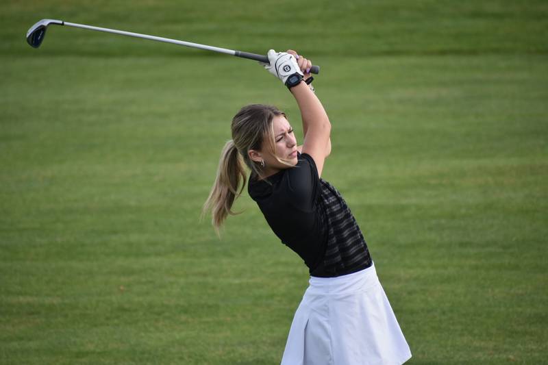Genoa-Kingston golfer Ava Smith tees off during a home meet on Tuesday, August 20, 2024.