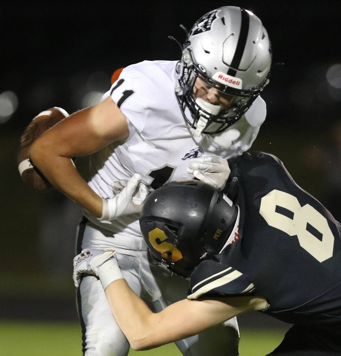 Sycamore's Brody Armstrong forces Kaneland's Dominick DeBlasio to fumble which resulted in a turnover during their game Friday, Sep. 10, 2021 at Sycamore High School.