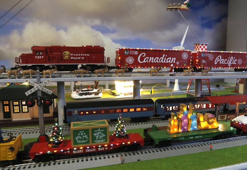 A section of John Smith’s holiday-themed trains on Thursday, Dec. 19, 2024, at his home in McHenry. He has been opening up his garage along the riverwalk during the weekends for people to see the trains.