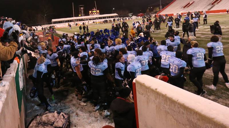 St. Francis players react with fans after winning the Class 5A State championship on Tuesday, Dec. 2, 2025 in Hancock Stadium at Illinois State University in Normal.