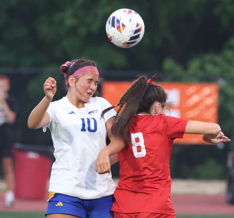 Johnsburg's London Baidinger (left) and Timothy Christian's Avery Croff go up for a header Thursday, June 5, 2025, during their IHSA Class 1A state semifinal at North Central College in Naperville.