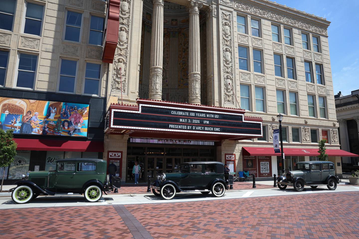 Several Ford Model A’s sit in front of the Rialto Theater at the theater’s 100th anniversary celebration on Sunday, May 3, 2026 in Joliet.