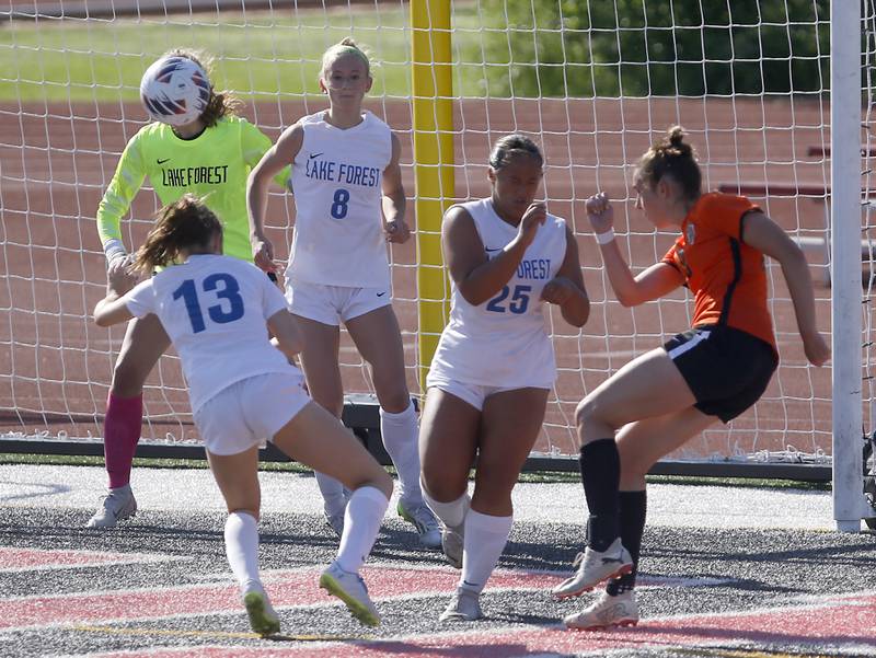 Crystal Lake Central's Jillian Mueller (right)  scores a goal during a Class 2A Deerfield Sectional semi-final match against Lake Forest on Tuesday, May 21, 2024, at Deerfield High School.