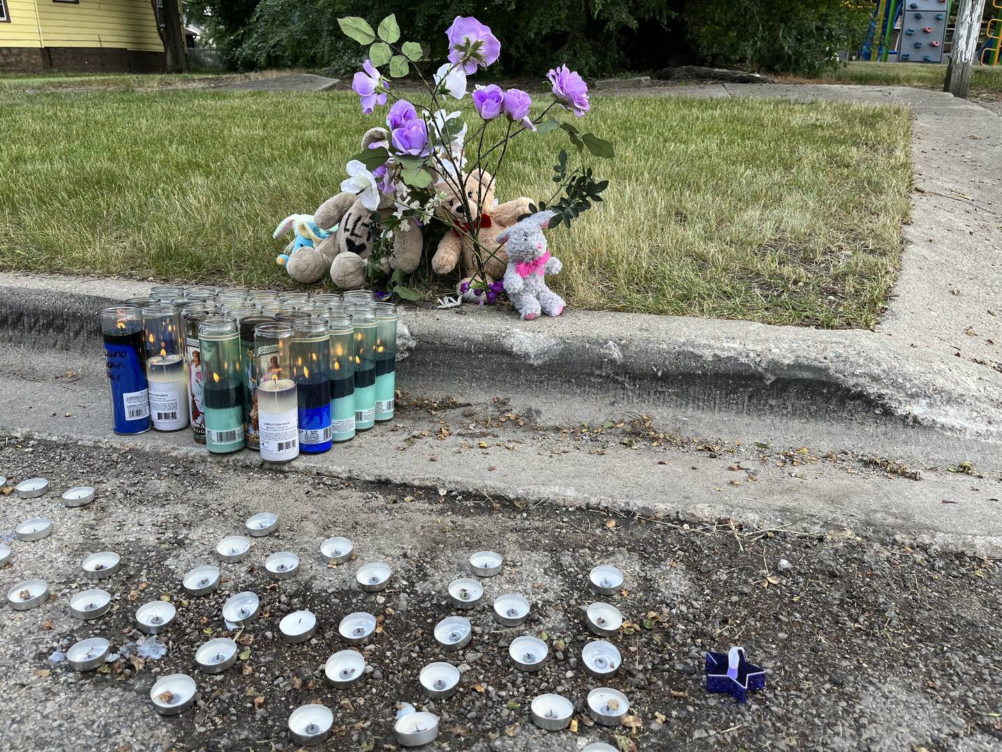 Flowers and candles established for Antoine Shropshire, 16, who was shot and killed on Tuesday, May 30, 2023 in the 400 block of South Joliet Street in Joliet.