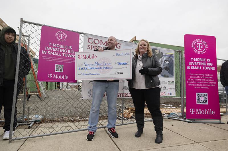 Sterling Main Street was one of 25 organizations that received the grant. T-Mobile pledges to donate 25 millions dollars to community based projects over the next 5 years. T-Mobile's Brock Burlack stands with Sterling Main Street's Janna Groharing.