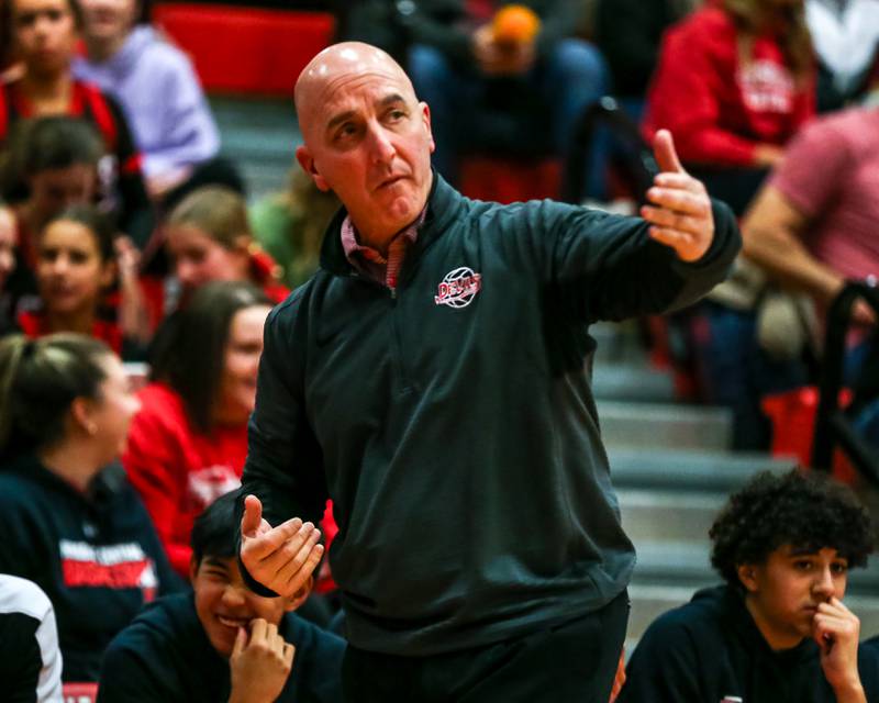 Hinsdale Central's head coach Nick Latorre instructs the team during their basketball game between Glenbard West at Hinsdale Central, Friday  Dec 6, 2024  in Hinsdale.