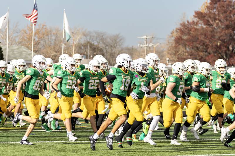 Providence’s players take the field prior to a 5A varsity football playoff game against Washington at Providence on Nov. 15, 2025.