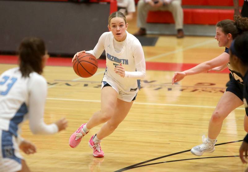 Nazareth’s Lyla Shelton drives toward the basket during a game against Neuqua Valley at Hinsdale Central on Thursday, Nov. 16, 2023.