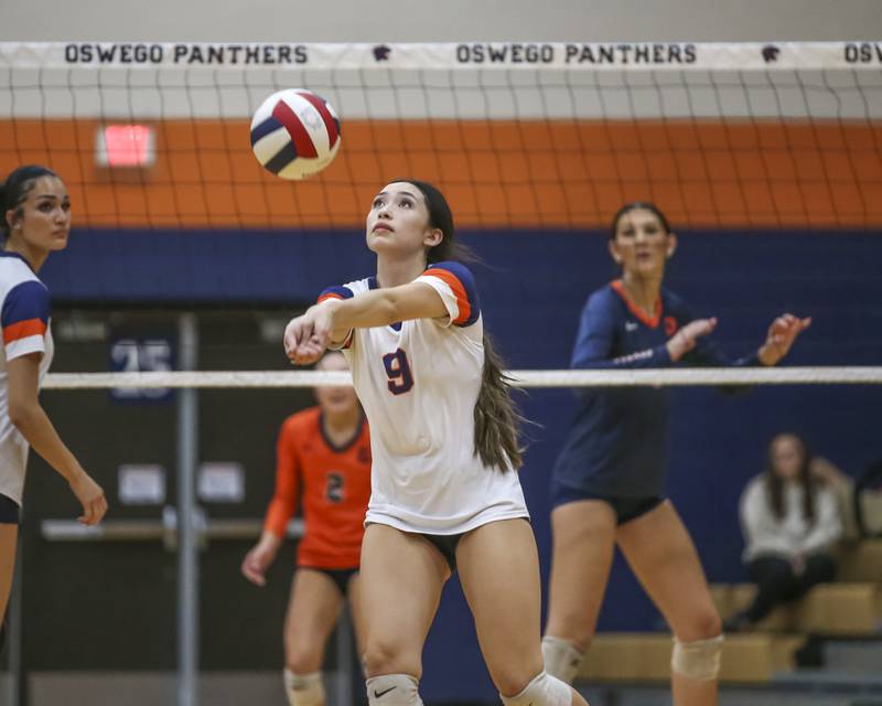 Romeoville's Kara Mark (9) eyes a dig during volleyball match between Romeoville at Oswego. Oct 16, 2025.