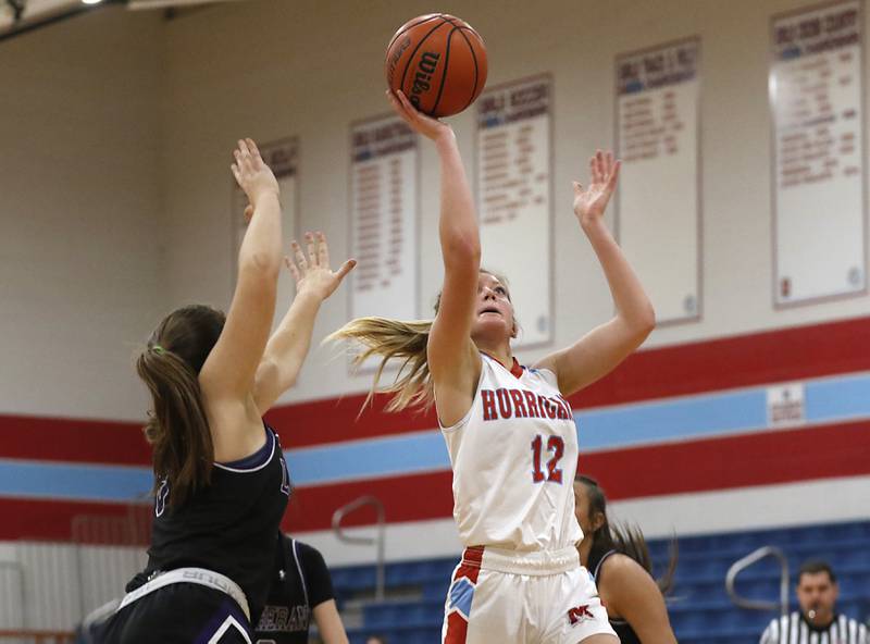 Marian Central's Madison Kenyon drives to the basket against Rockford Lutheran's Addie Richard during a non-conference girls basketball game Monday, Dec. 12, 2022, between Marian Central and Rockford Lutheran at Marian Central Catholic High School, in Woodstock.