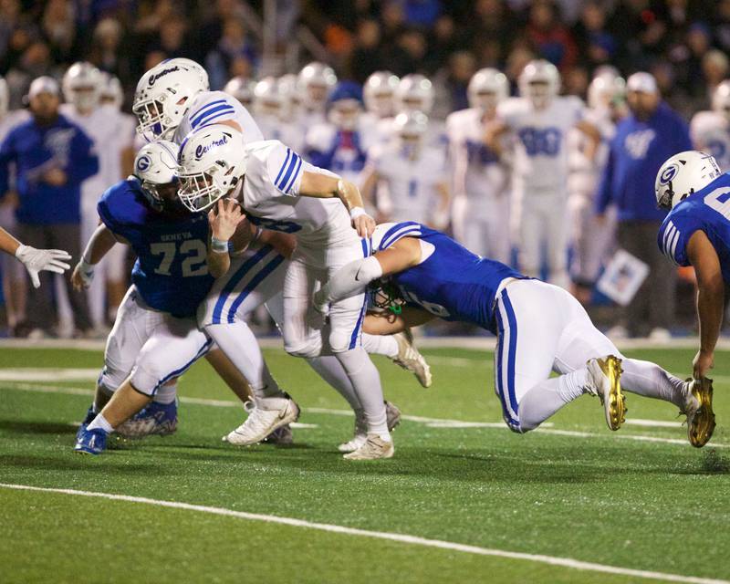 Burlington Central's Tyler McGladdery is tackled by Geneva's Gavin Burt at the Class 6A second-round playoff game on Saturday Nov.9,2024 in Geneva.