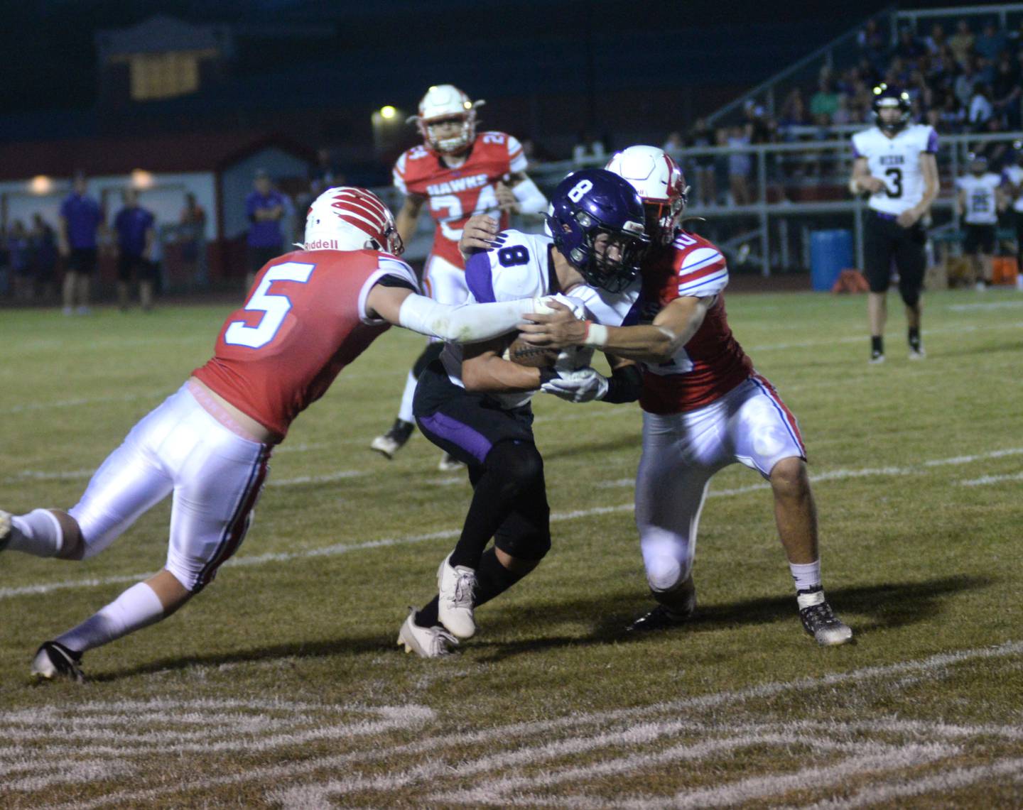 Dixon's Tyson Dambman (8) fights for yards against Oregon on Friday, Sept. 1, 2023 at Oregon High School's Landers-Loomis Field/