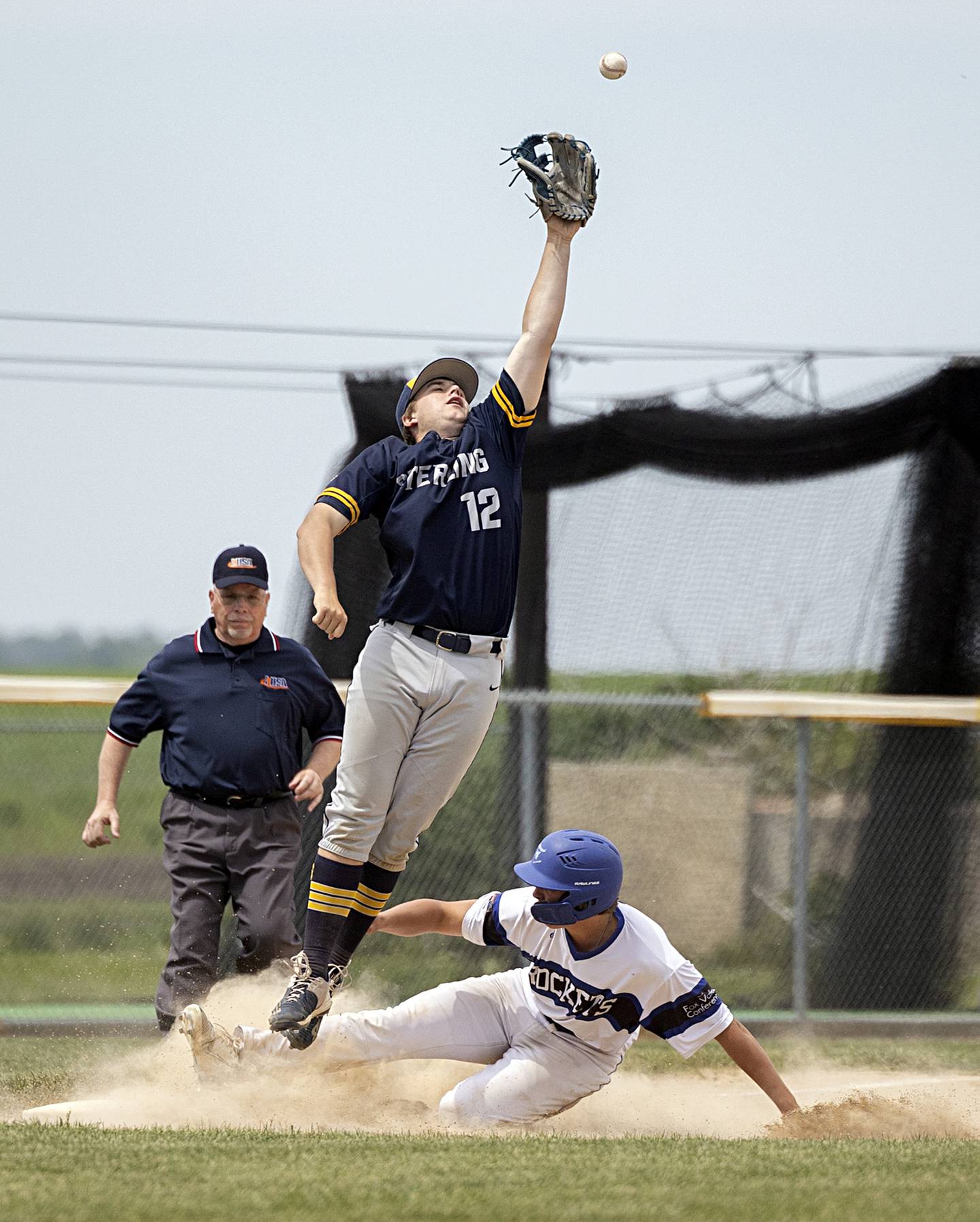 Sterling’s Drew Nettleton leaps for a high throw against Burlington Central during a class 3A regional final in Rochelle Saturday, May 27, 2023.