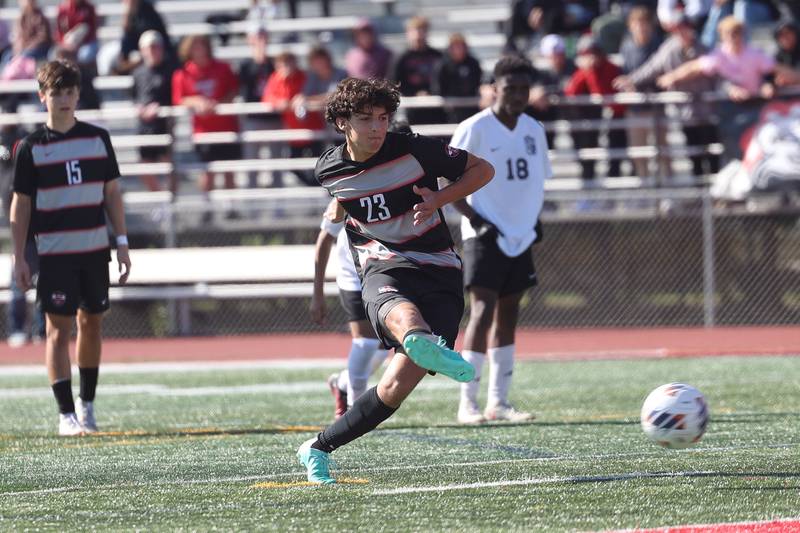 Lincoln-Way Central’s Dylan Maksa scores on a penalty shot in overtime against TF North in the Class 3A regional championship on Saturday, Oct. 21 in New Lenox.