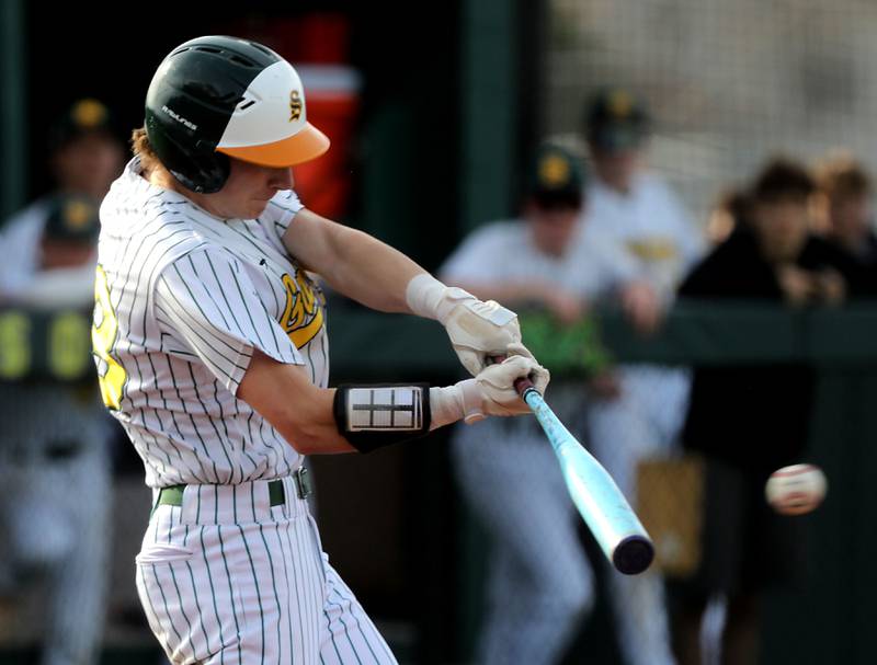 Crystal Lake South's Carson Trivellini hist a single during a Fox Valley Conference baseball game against McHenry on Monday, April 13, 2026, at Crystal Lake South High School.