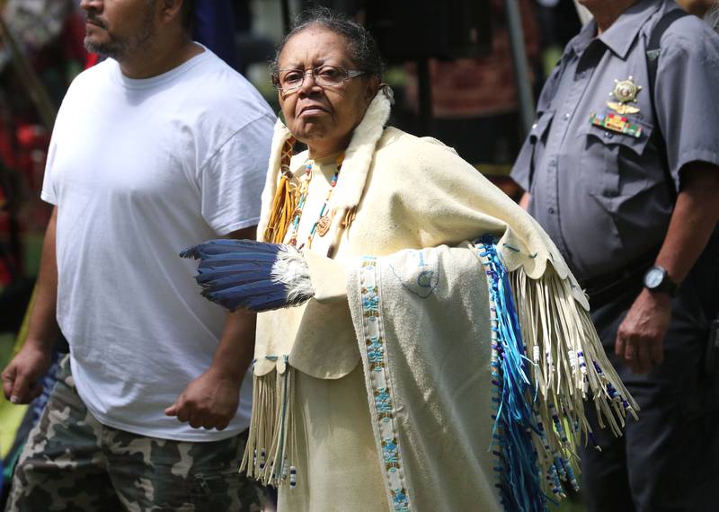 Laughs-a-Lot, of Schaumburg, a member of the Chickamauga Cherokee Tribe, walks in the Grand Entry during the 30th Annual Potawatami Trails Pow-Wow at Shiloh Park on Saturday, August 26th in Zion. 
Photo by Candace H. Johnson for Shaw Local News Network