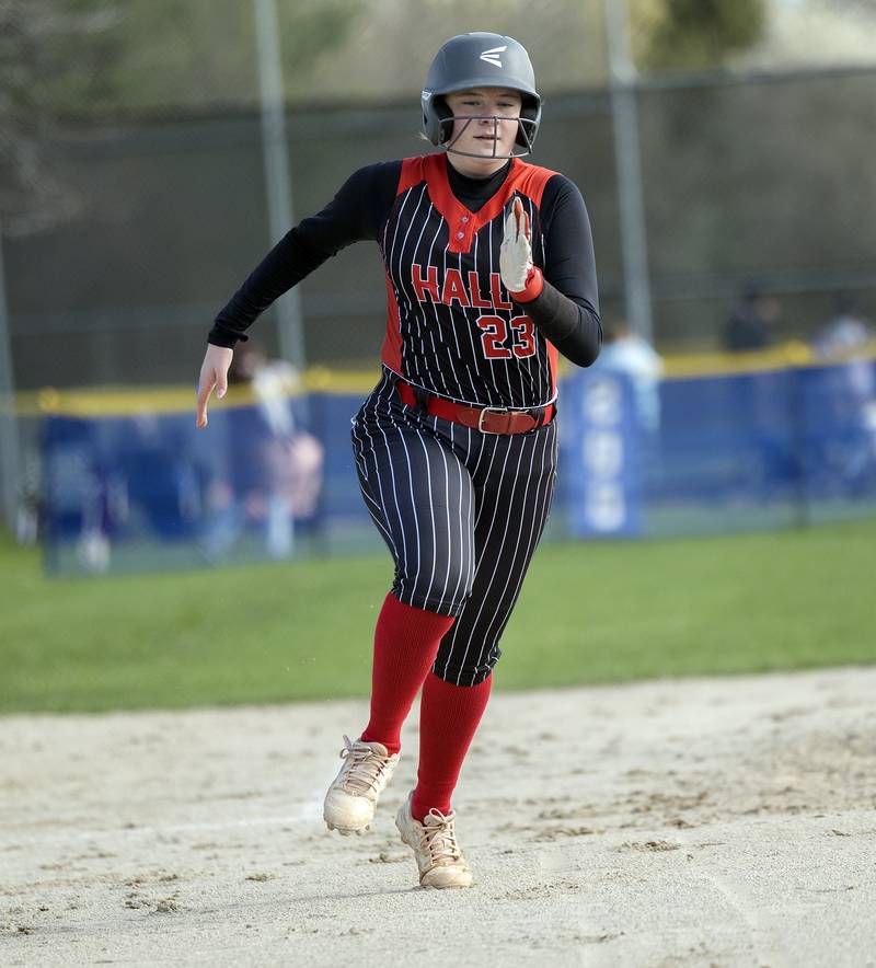 Hall’s Leah Burkart heads home for a score against Newman Monday, April, 21, 2025.