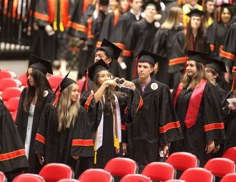 Batavia High School graduates enter the Northern Illinois University Convocation Center in DeKalb for the school’s 2022 commencement ceremony on Wednesday, May 25, 2022.