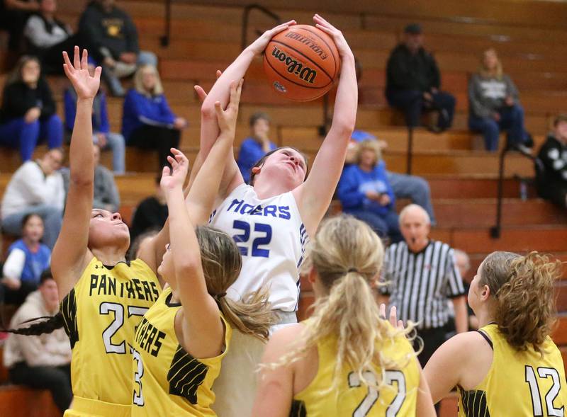 Princeton's Camryn Driscoll grabs a rebound over multiple Putnam County defenders during the Princeton Holiday Girls Basketball Tournament on Tuesday, Nov. 19, 2024 at Princeton High School.