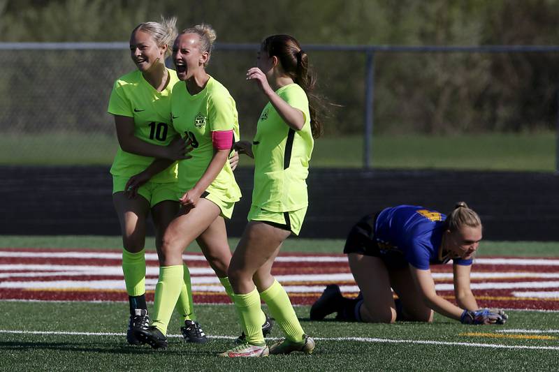 Richmond-Burton's Layne Frericks (center) celebrates her goal with teammates, Jordan Otto (left) and Nicole Mendlik, during the Kishwaukee River Conference Girls Soccer Tournament Championship Match against Johnsburg on Wednesday, May 1, 2024, at Richmond-Burton High School.