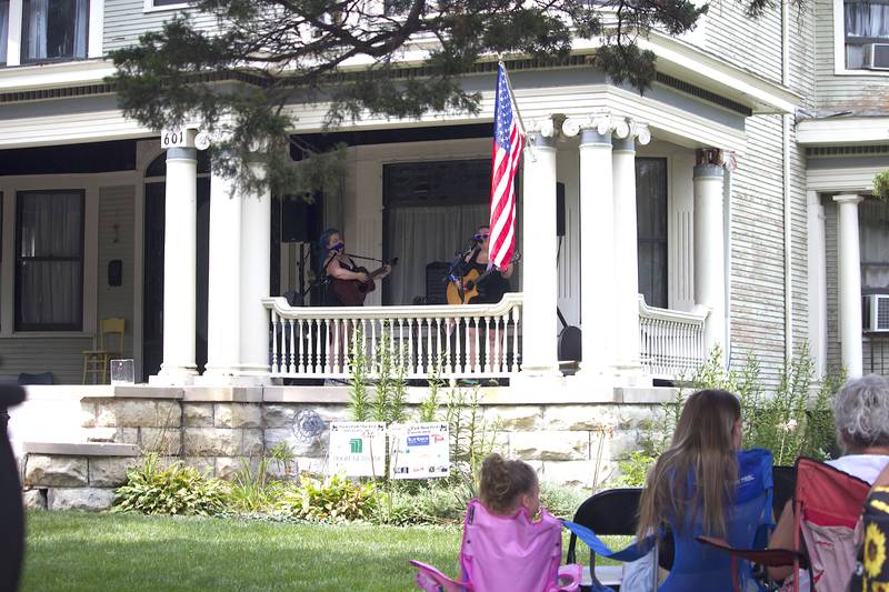 Musicians Colleen Wilde (left) and Cheryl Rodey perform in the 600 block of Campbell Street in Joliet as part of the Porch and Park Music Fest on Saturday, Aug. 16, 2025.