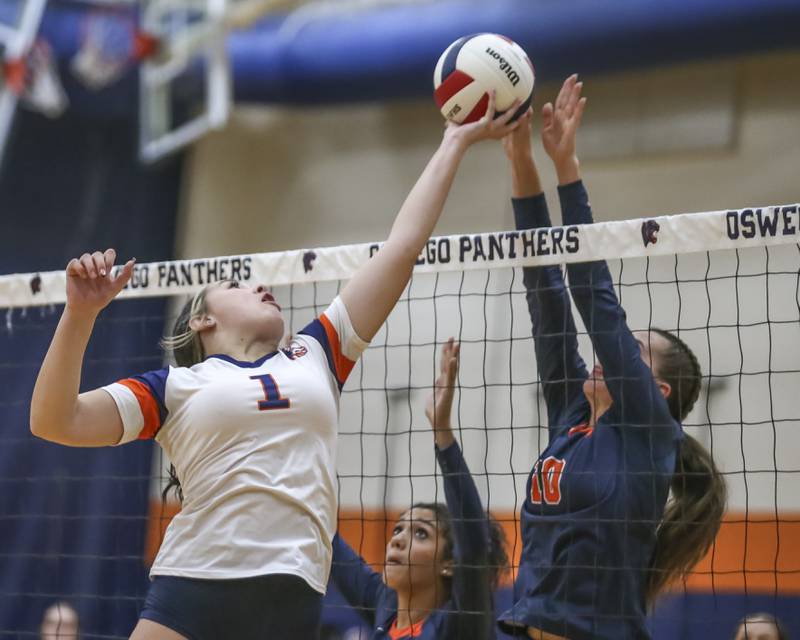 Romeoville's Aubree Westerfield (1) attempts a tip at the net during volleyball match between Romeoville at Oswego. Oct 16, 2025.