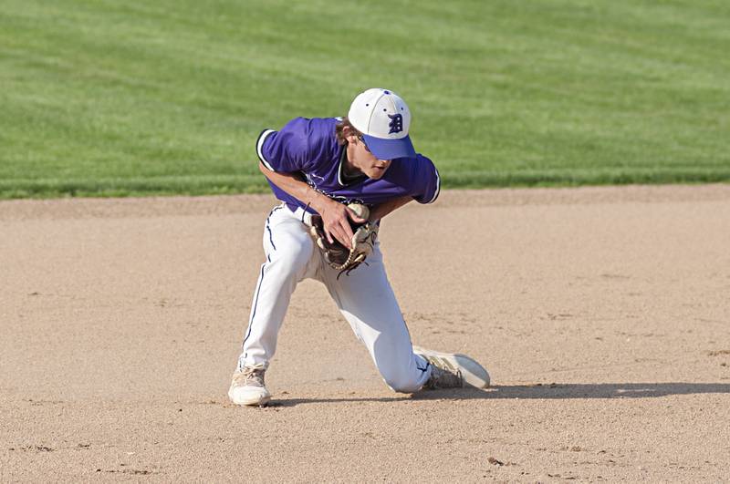 Dixon’s Bryce Feit scoops up a grounder at shortstop against North Boone Thursday, May 12, 2022.