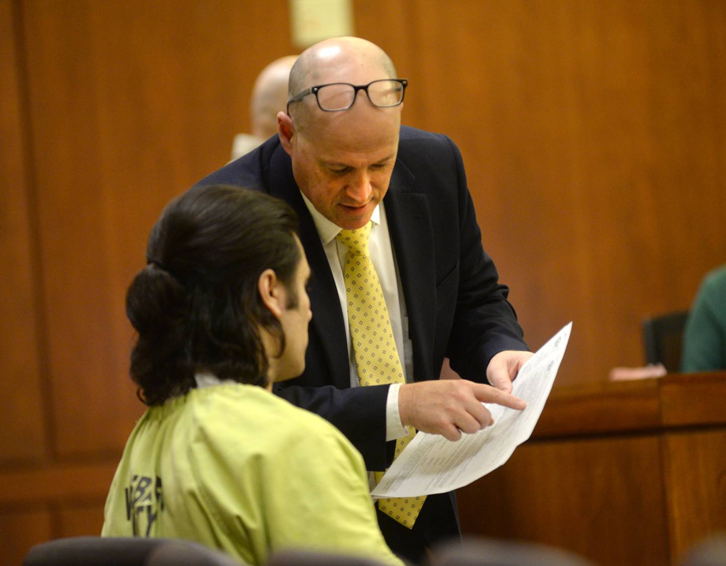 Ogle County Assistant Public Defender Michael O'Brien talks with Jonathon Gounaris, 32, before a Thursday, Dec. 19, 2024 hearing at the Ogle County Judicial Center in Oregon. Gounaris, 32 charged with four counts of attempted first-degree murder in connection with a June incident at his rural home where three police officers were shot. He has pleaded not guilty to the charges and is being held in the Winnebago County Jail as his case proceeds through the court system.