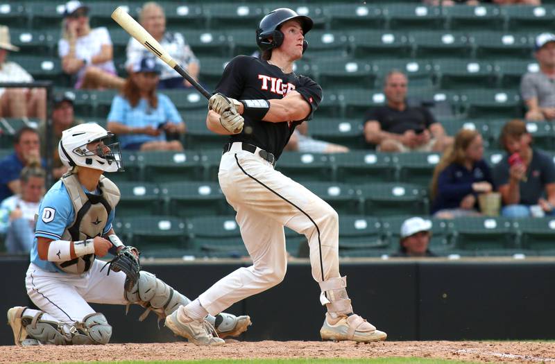 Crystal Lake Central’s Connor Gibour connects for a triple in supersectional baseball action against DePaul College Prep at Wintrust Field in Schaumburg Monday.