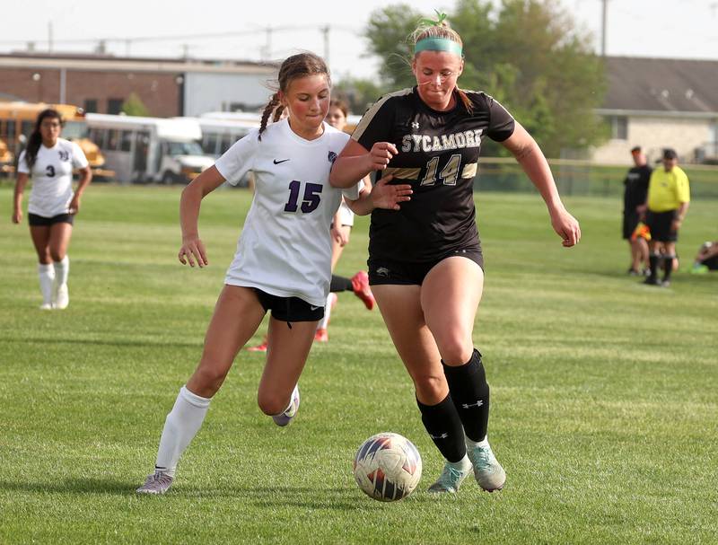 Dixon’s Jenna Harrison (left) and Sycamore's Peyton Wright try to win possession during their game Thursday May 15, 2025, at Sycamore High School.