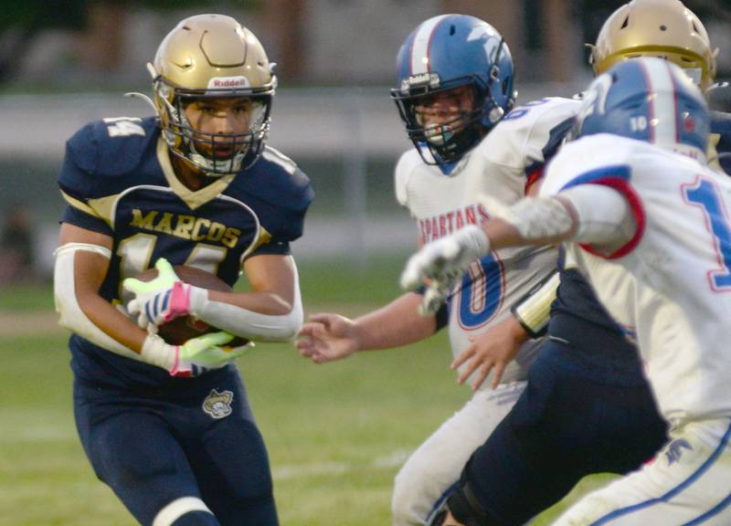 Polo's  Jordan Reed (14) runs for a gain against Bushnell-Prairie City on Friday, Aug, 29, 2025 in Polo.