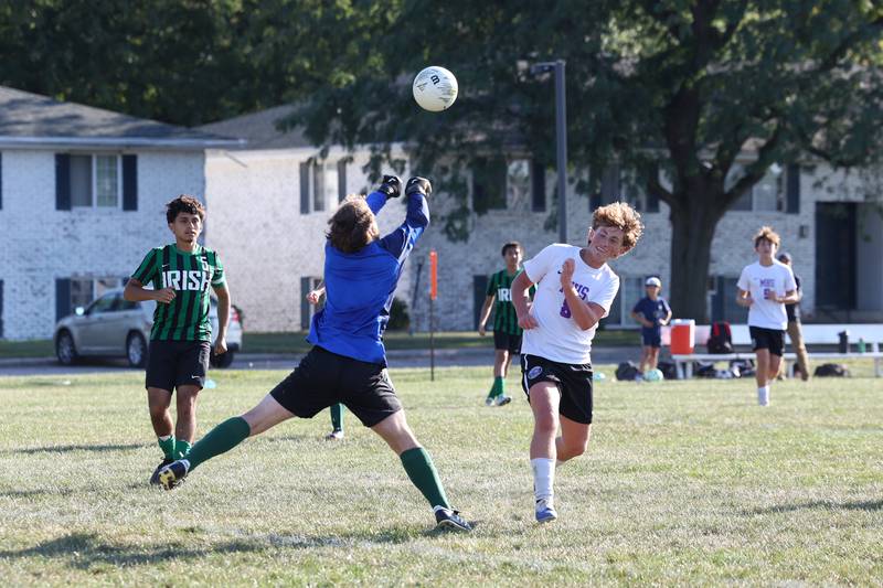 Bishop McNamara goalkeeper Matthew Buzas knocks a pass away ahead of Manteno's Gio Arrigo during the Panthers' 10-0 victory over Bishop McNamara on Monday, Sept. 8, 2025.