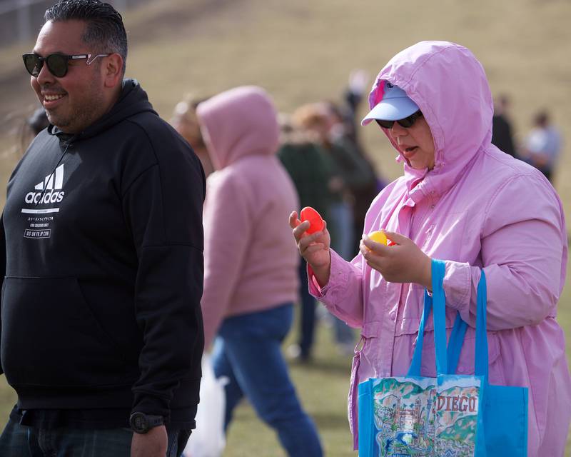 Participants check their eggs at the Adult Easter Egg Hunt on Saturday, March 15, 2025 at Berens Park in Elmhurst.