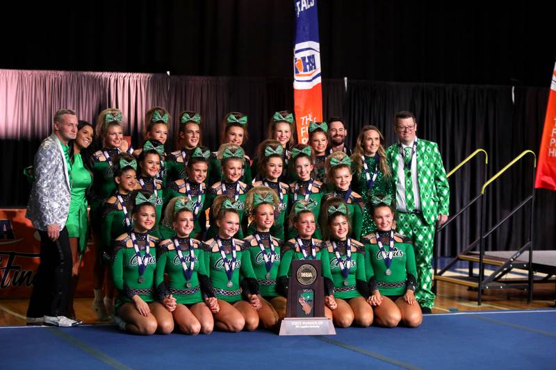 Members of the Providence Catholic cheerleading team celebrate their second-place finish in the medium team division of the IHSA State Finals on Saturday, Feb. 8, 2025 at Grossinger Motors Arena in Bloomington.