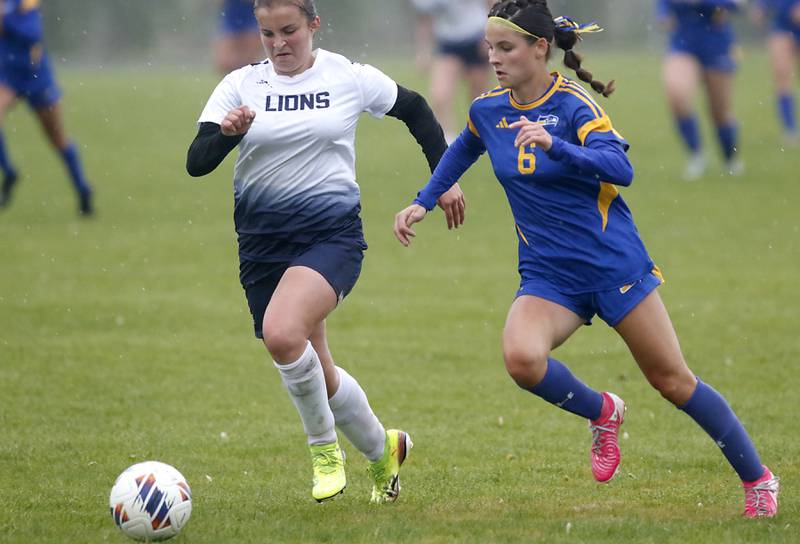 Johnsburg's Liz Smith (right) races Harvest Christian Academy's Lily Johnson to the ball during the Class 1A Marian Central Girls Soccer Regional Championship match on Tuesday, May 20, 2025, at Marian Central High School in Woodstock.