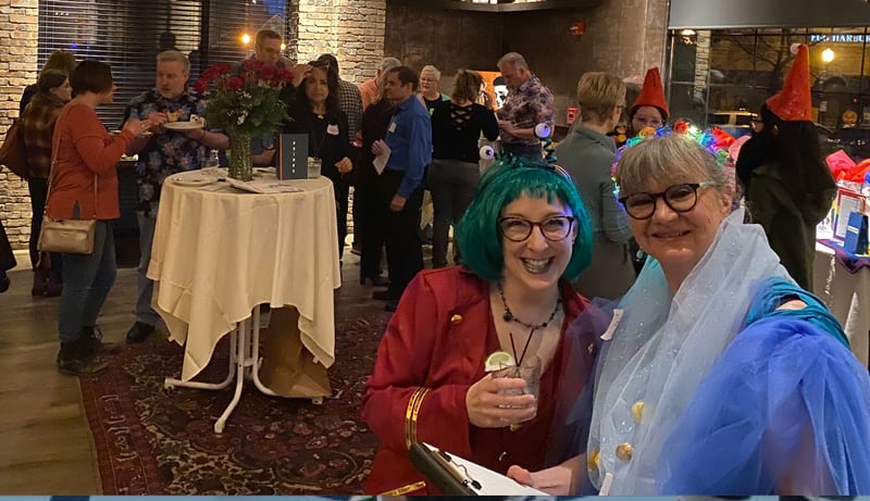 Jodi Nordmann Harap, left, and Debbie Anderson-Phillips, members of EQuality Downers Grove leadership, join other members of the organization and guests at a recent One Book, One Town  community reading kickoff event at Cadence Kitchen