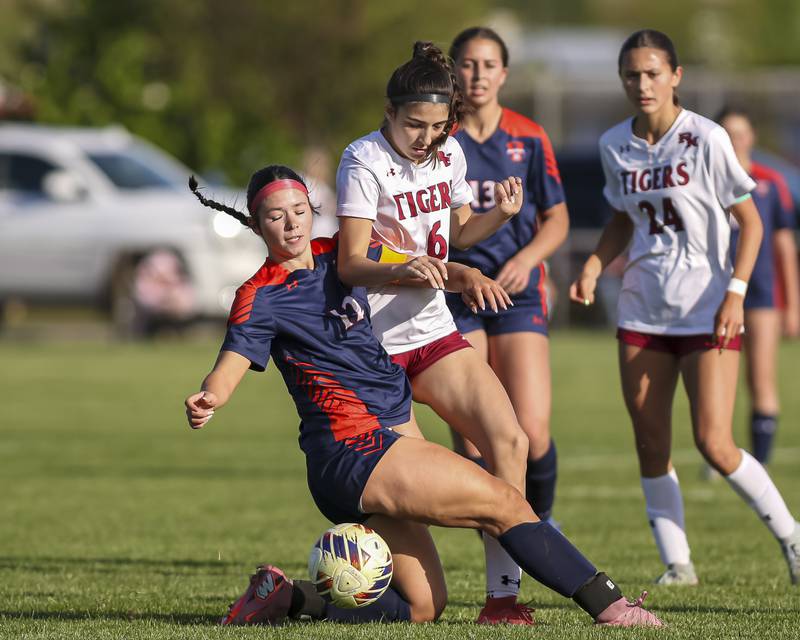 Oswego's Kailey Smith (12) collides with Plainfield North's Katelyn Haiser (6) during a soccer match between Plainfield North at Oswego on Monday, May 11, 2026 in Oswego.