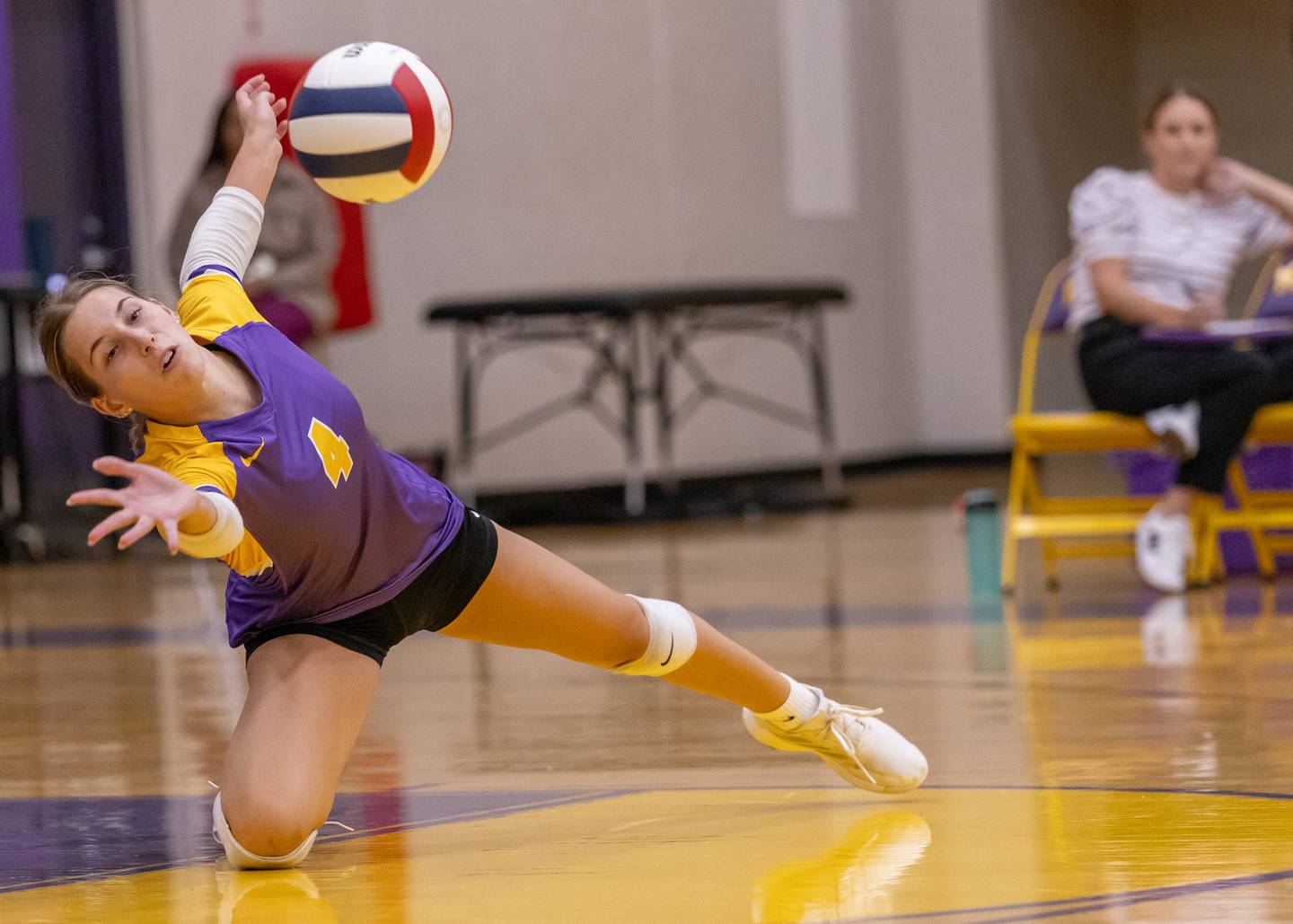 Laylie Denault dives for the ball in attempt to save the point against Hall High School during the match on Sept. 2, 2025 at Mendota High School.