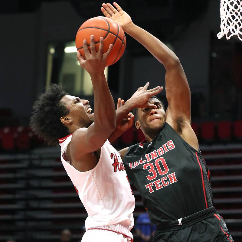 Northern Illinois' Zion Russell tries to score over Illinois Tech's Garrison Carter during their game Monday, Nov. 13, 2023, at the NIU Convocation Center in DeKalb.