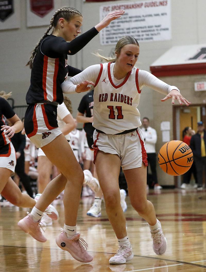 Huntley's Anna Campanelli is fouled by Libertyville's Lily Fisher as she brings the ball up the court during the IHSA Class 4A Huntley Sectional Championship girls basketball game on Thursday, Feb. 27, 2025, at Huntley High School.