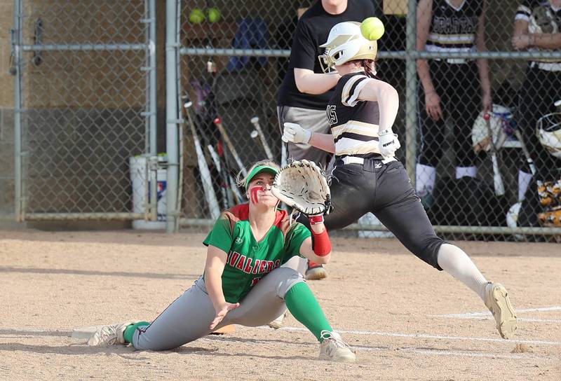Sycamore's Tia Durst beats out an infield single as LaSalle-Peru's Ava Lannen stretches for the throw during their game Tuesday, April 11, 2023, at Sycamore High School.